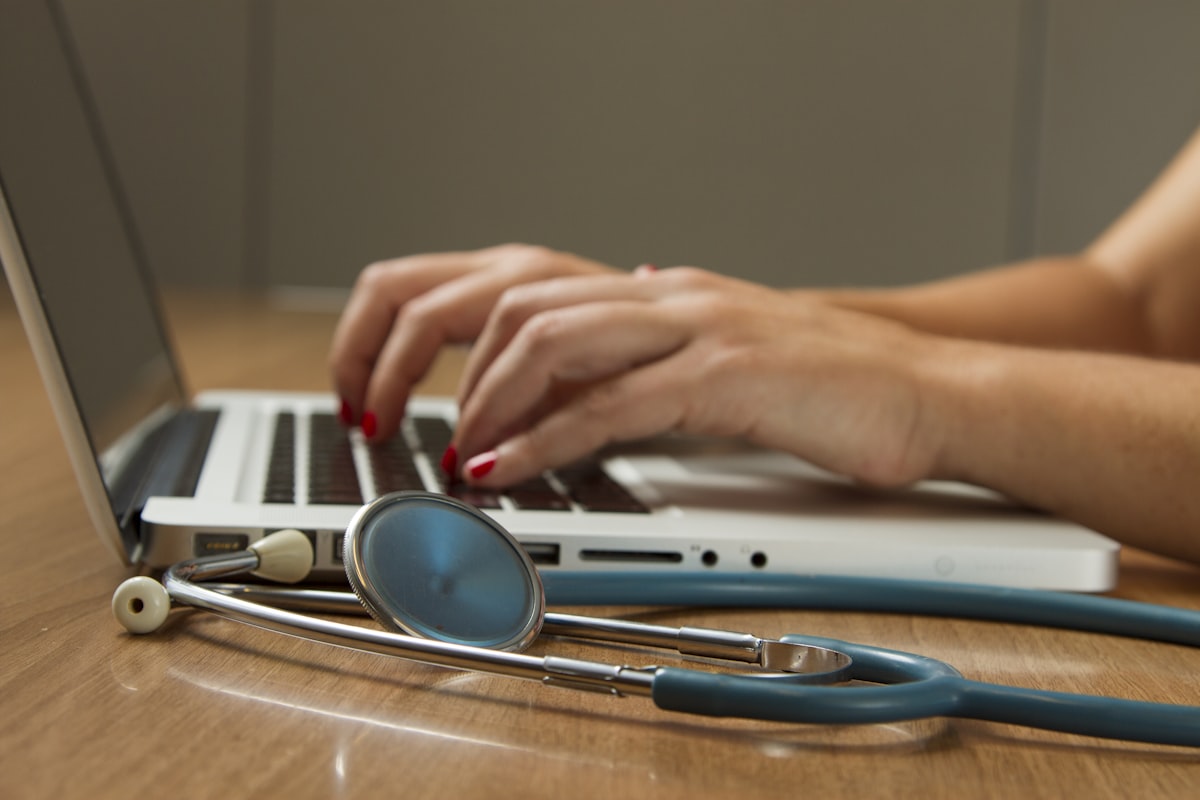 Doctor reviewing digital medical records on a tablet
